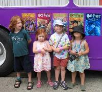 Young readers await their turn to climb on board.